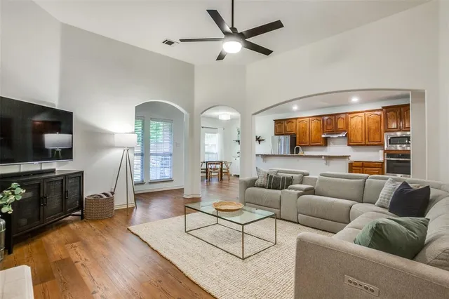 a living room with furniture fireplace and a flat screen tv