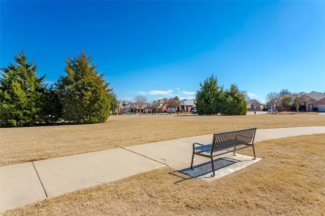 a view of a lake with outdoor space and seating