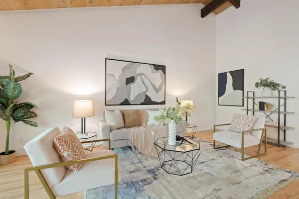 a living room with furniture and a table