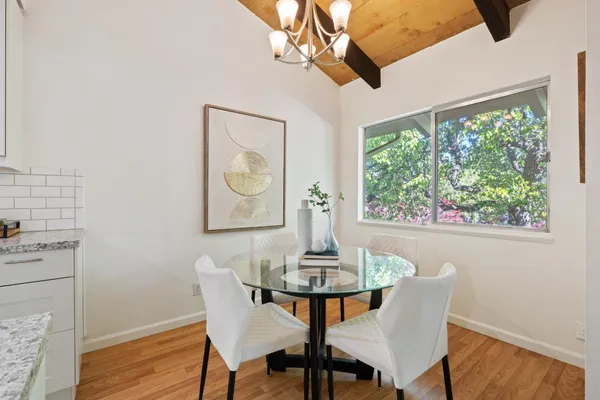 a view of a dining room with furniture window and wooden floor