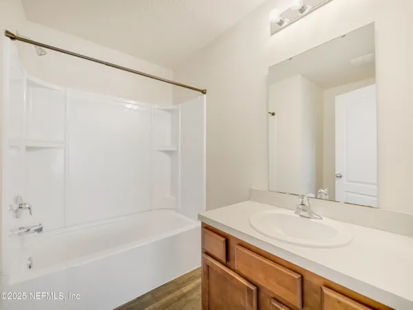 a bathroom with a sink and a bathtub