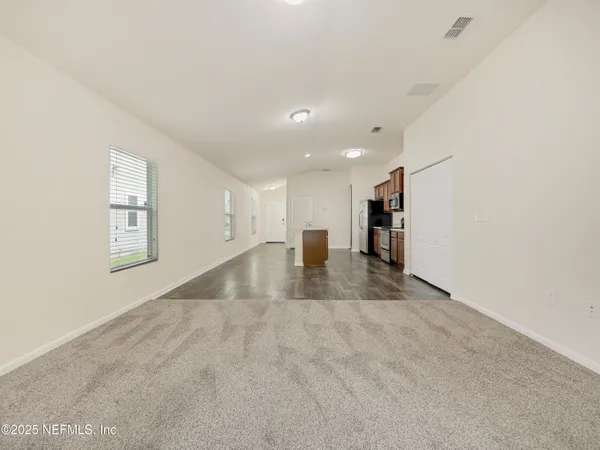 a view of kitchen and a window