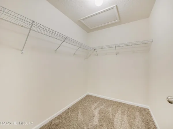 a view of a room with racks on the wall