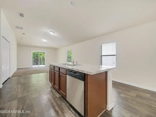 a kitchen with a stove and a sink