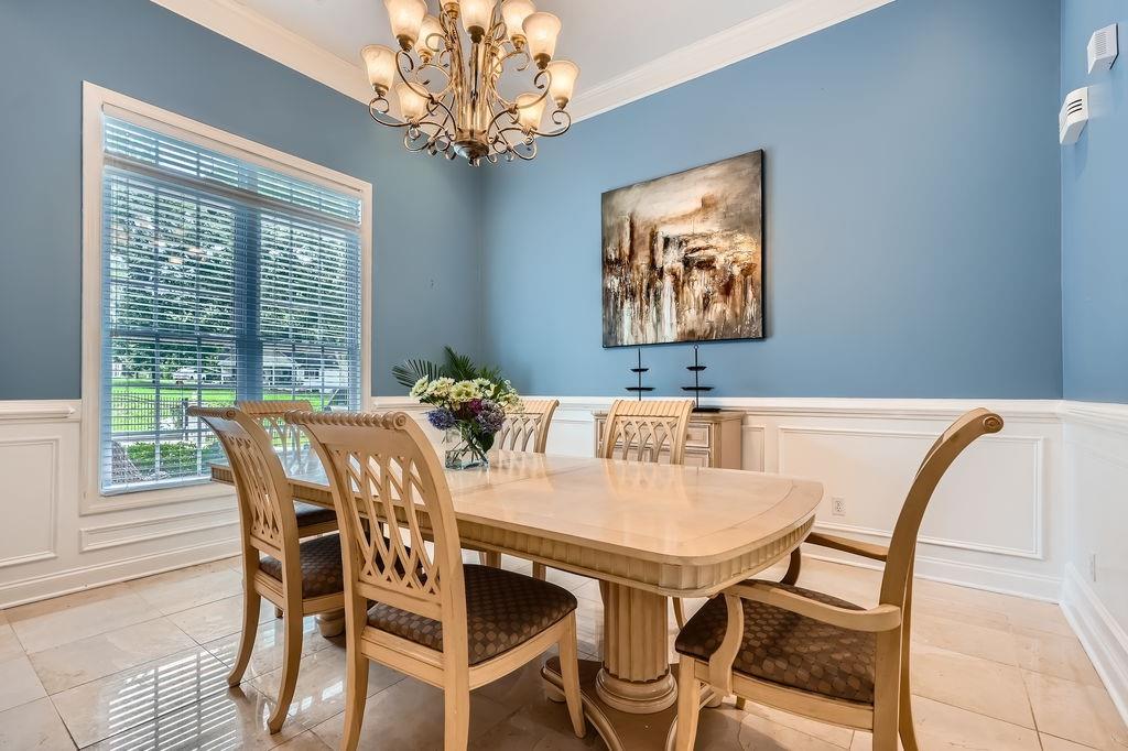 4829 Moon Road Powder Springs, GA 30127 - Photo 11 of 51 a view of a dining room with furniture window and outside view