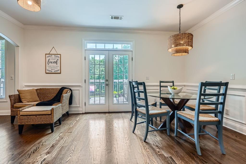 4829 Moon Road Powder Springs, GA 30127 - Photo 16 of 51 a dining room with furniture and wooden floor