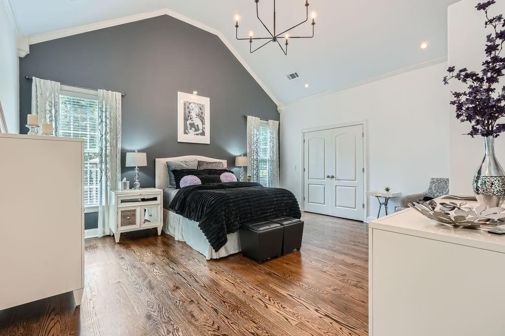 4829 Moon Road Powder Springs, GA 30127 - Photo 27 of 51 a bedroom with a bed and wooden floor