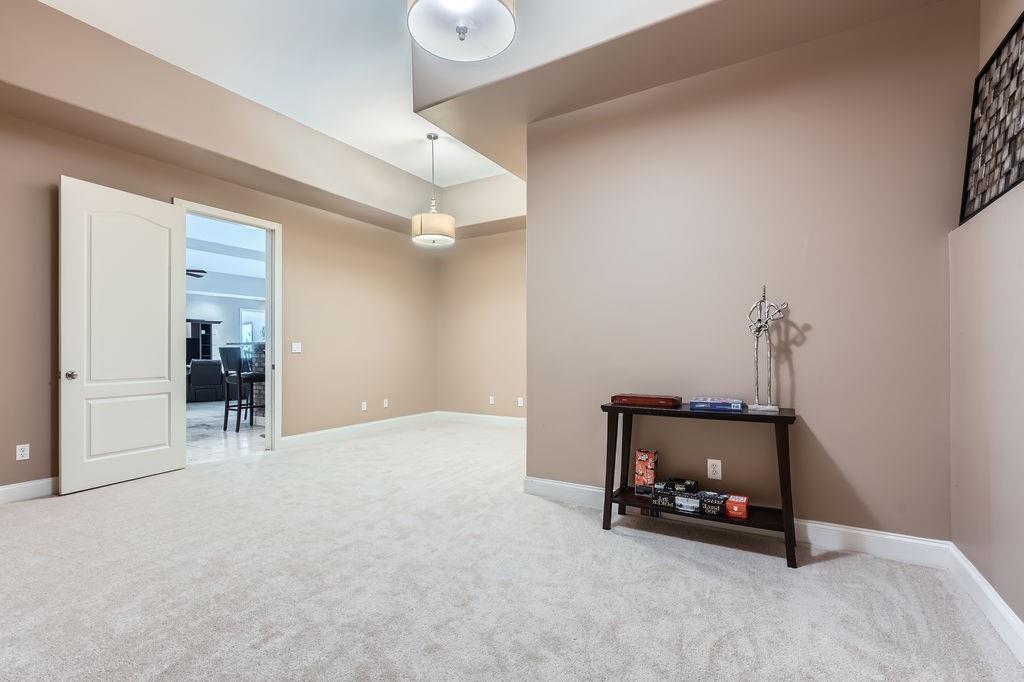 4829 Moon Road Powder Springs, GA 30127 - Photo 32 of 51 a room with furniture and a flat screen tv