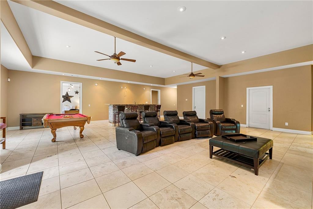 4829 Moon Road Powder Springs, GA 30127 - Photo 36 of 51 a living room with furniture and a chandelier