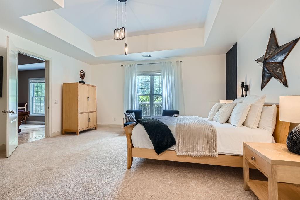 4829 Moon Road Powder Springs, GA 30127 - Photo 38 of 51 a spacious bedroom with a bed and a window