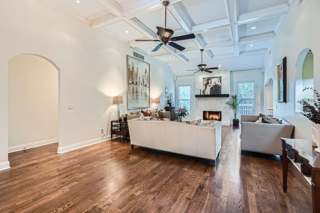 4829 Moon Road Powder Springs, GA 30127 - Photo 9 of 51 a living room with couches and kitchen view with wooden floor