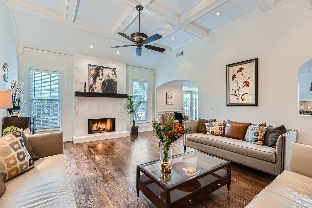 4829 Moon Road Powder Springs, GA 30127 - Photo 10 of 51 a living room with furniture a fireplace and a flat screen tv