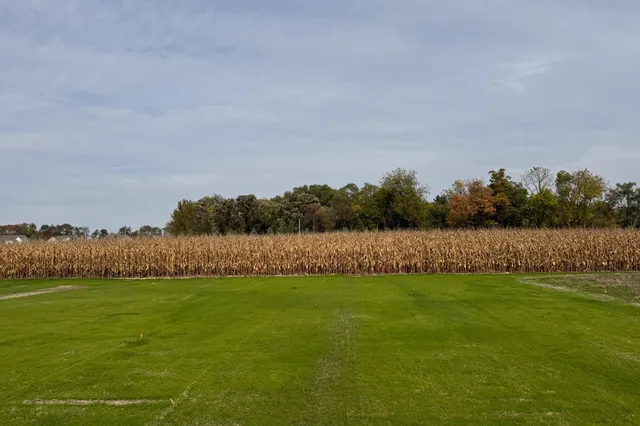 a house that is sitting in the grass