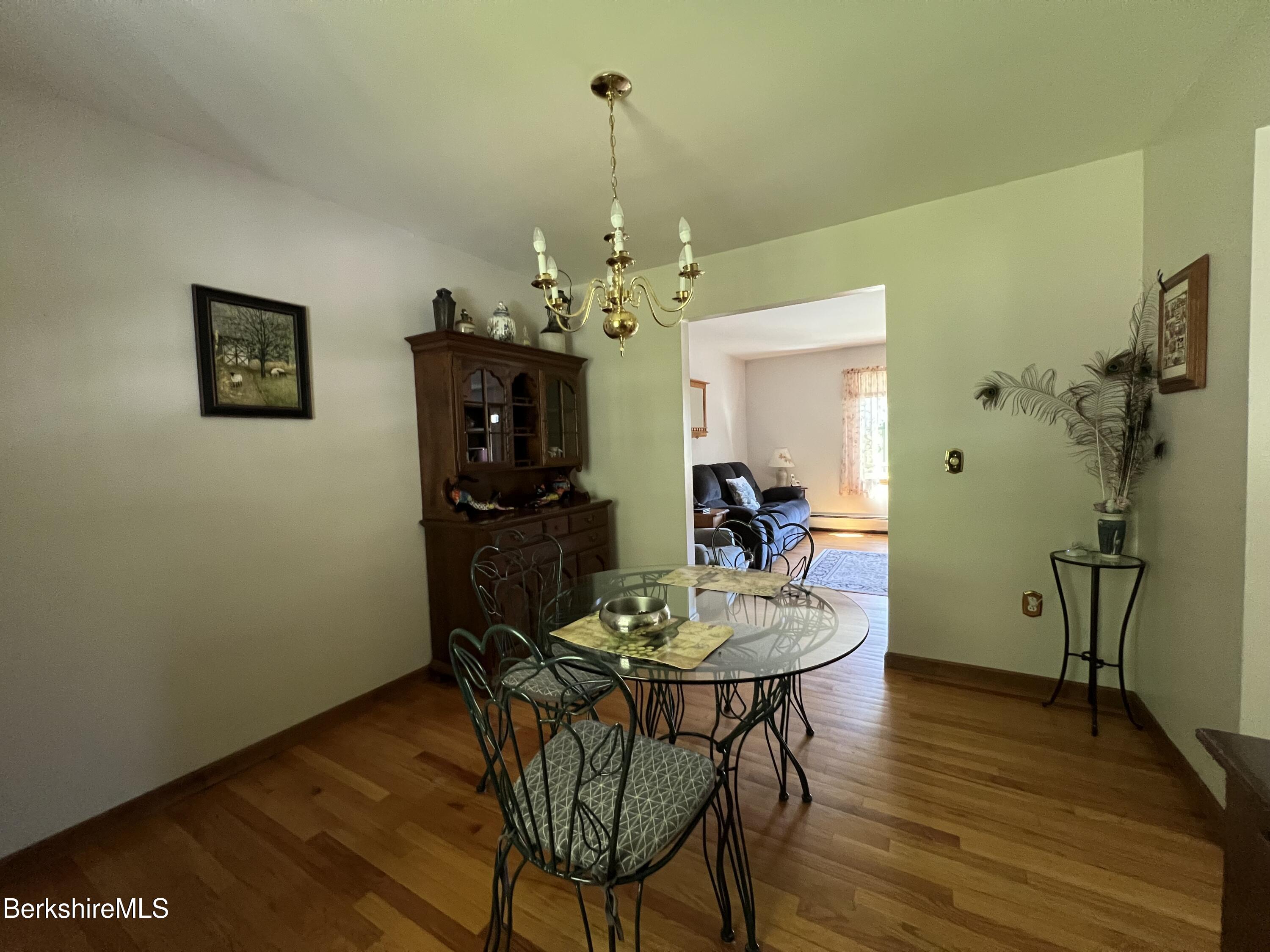 215 Partridge Road Pittsfield, MA 01201 - Photo 14 of 38 a dining room with furniture and wooden floor
