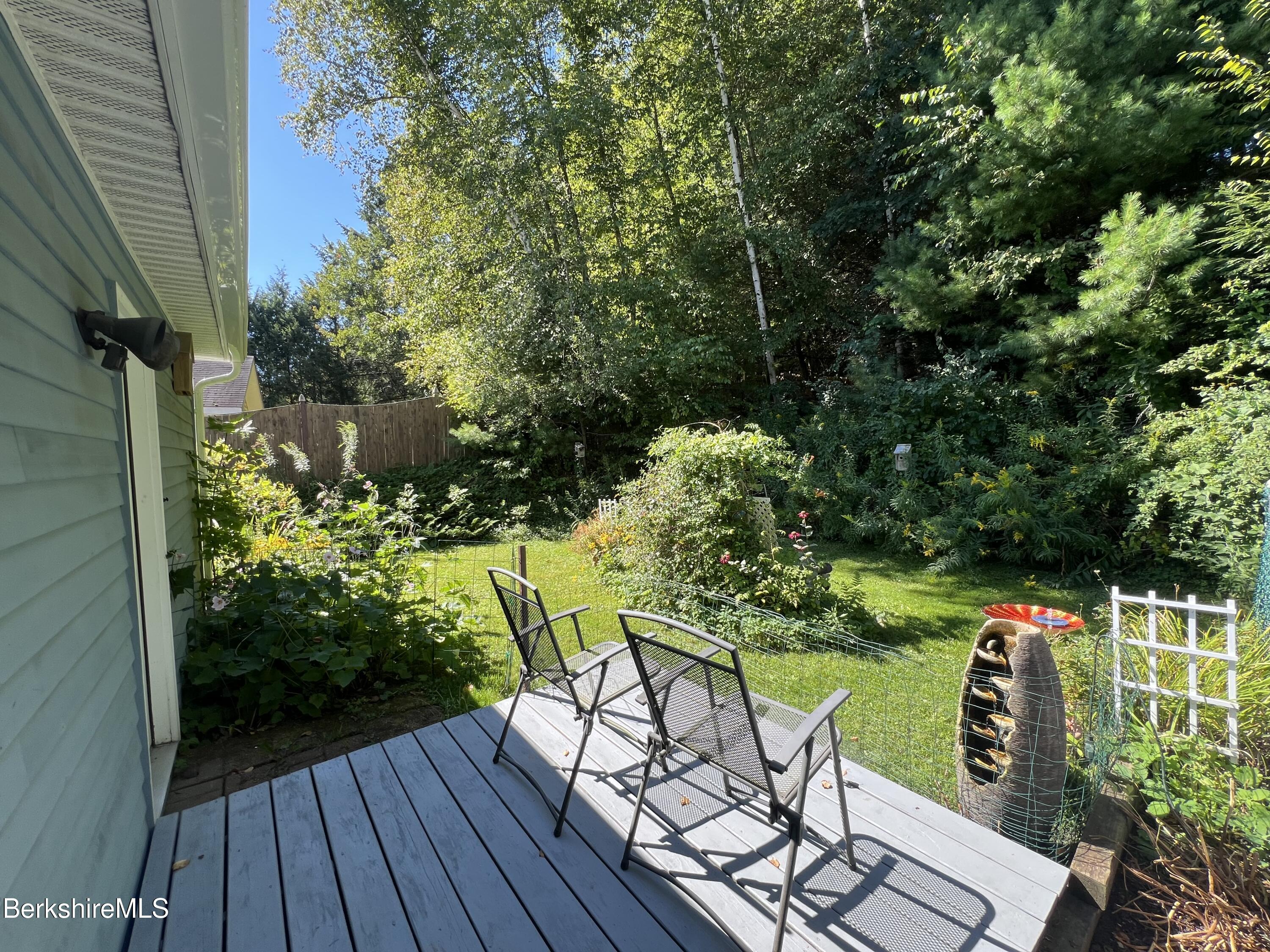 215 Partridge Road Pittsfield, MA 01201 - Photo 22 of 38 a view of table and chairs in patio of a house