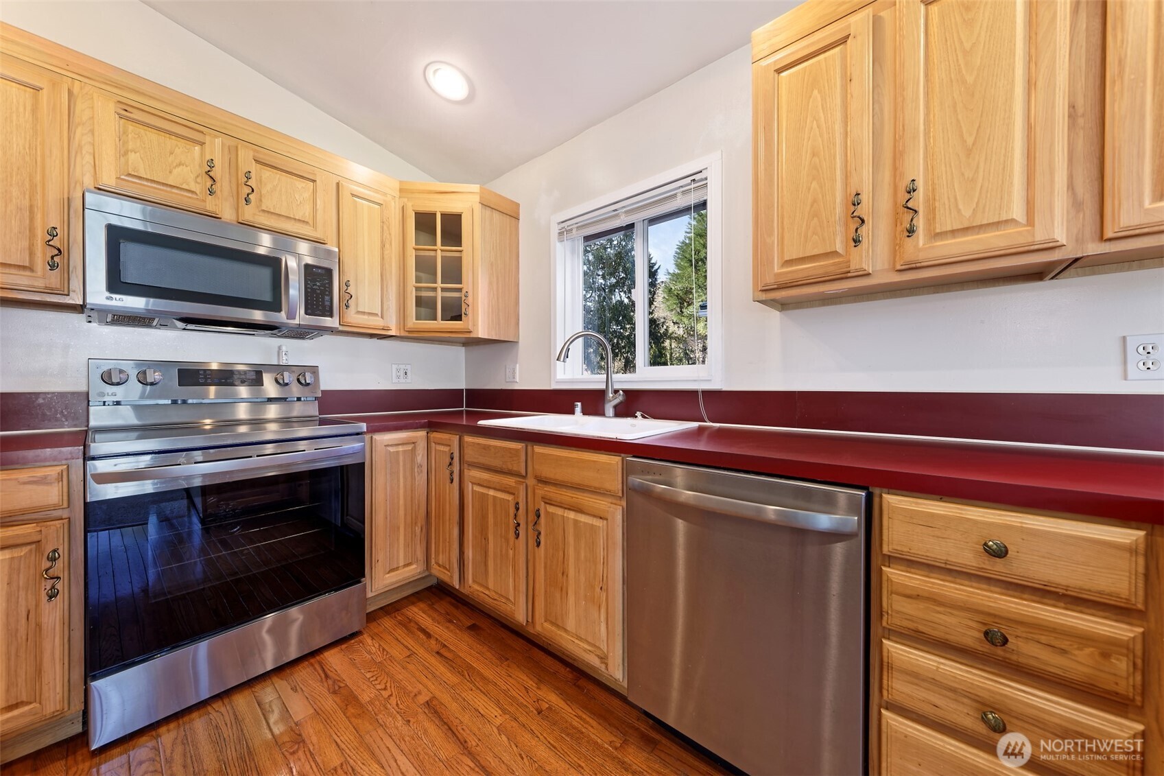 30 Brook Place Tahuya, WA 98588 - Photo 27 of 40 a kitchen with stainless steel appliances granite countertop a stove a sink and a microwave
