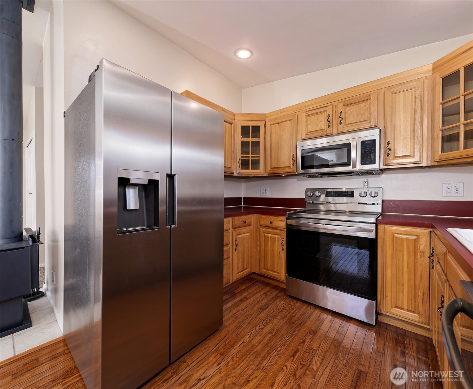 30 Brook Place Tahuya, WA 98588 - Photo 28 of 40 a kitchen with stainless steel appliances and wooden cabinets