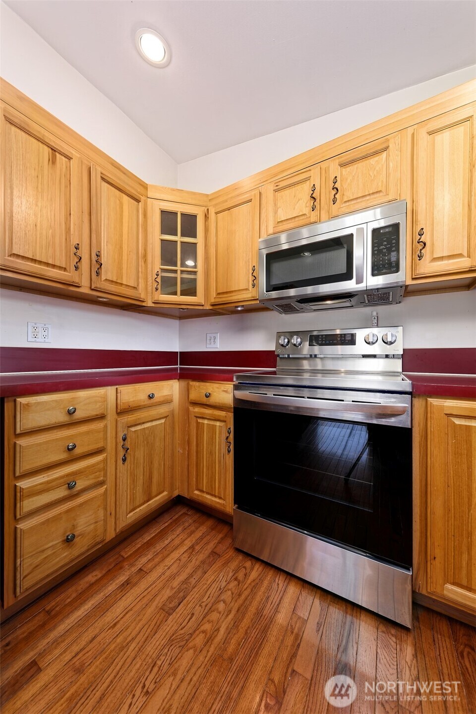 30 Brook Place Tahuya, WA 98588 - Photo 30 of 40 a kitchen with stainless steel appliances granite countertop a stove and a microwave