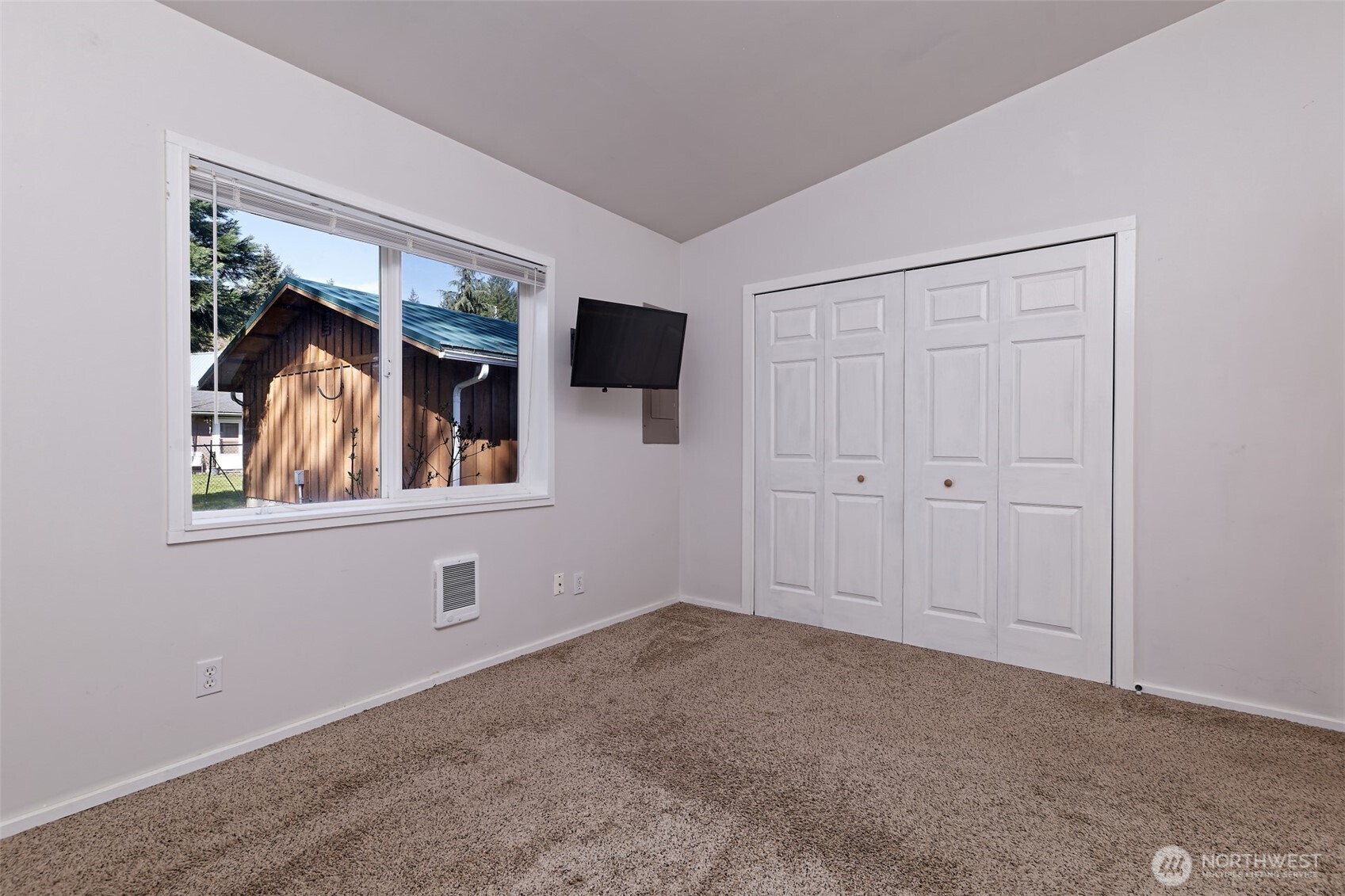 30 Brook Place Tahuya, WA 98588 - Photo 31 of 40 a view of an empty room with a window and wooden floor