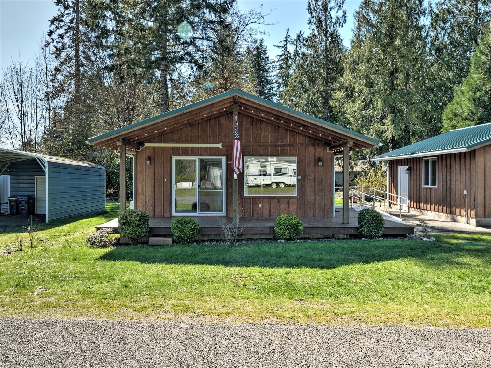 30 Brook Place Tahuya, WA 98588 - Photo 4 of 40 a front view of a house with a yard