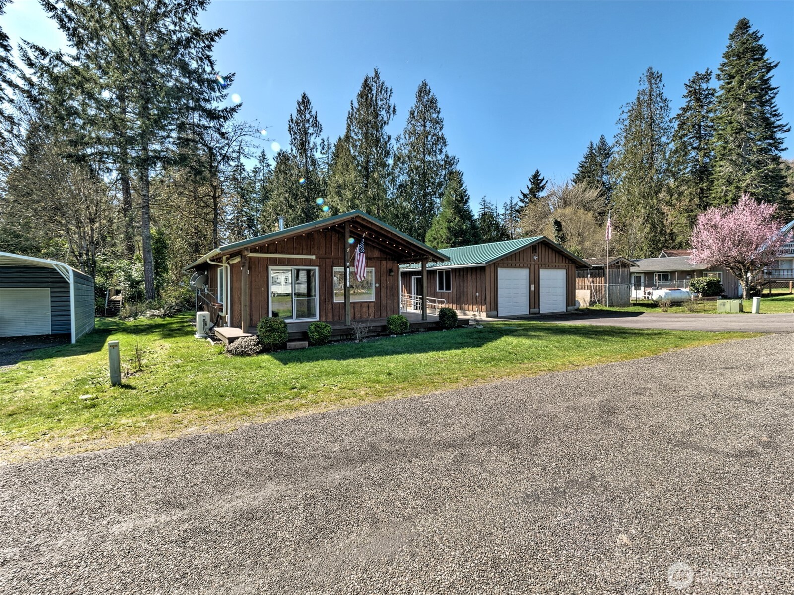 30 Brook Place Tahuya, WA 98588 - Photo 6 of 40 a house with green field in front of it