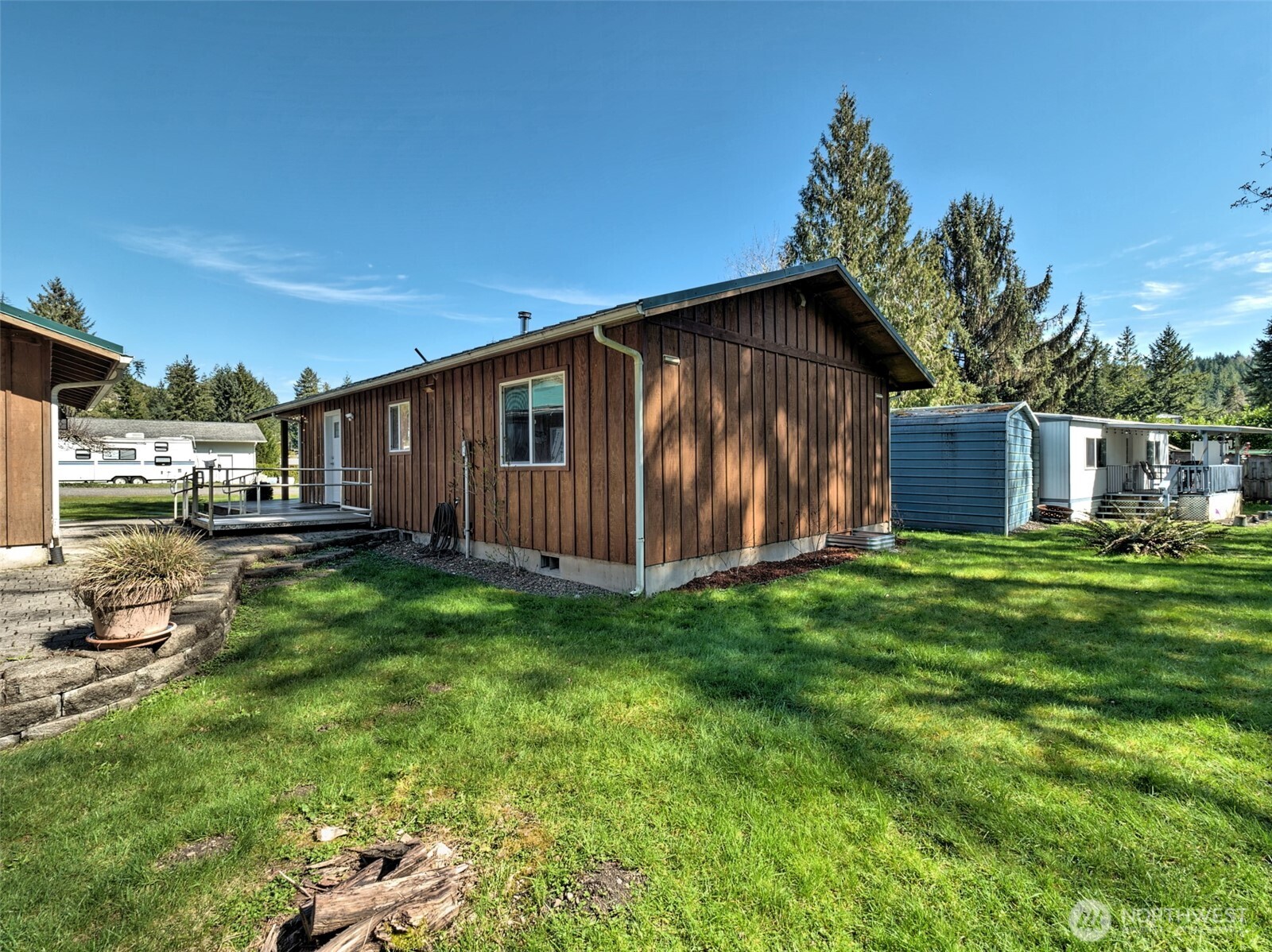 30 Brook Place Tahuya, WA 98588 - Photo 8 of 40 a backyard of a house with barbeque oven and outdoor seating