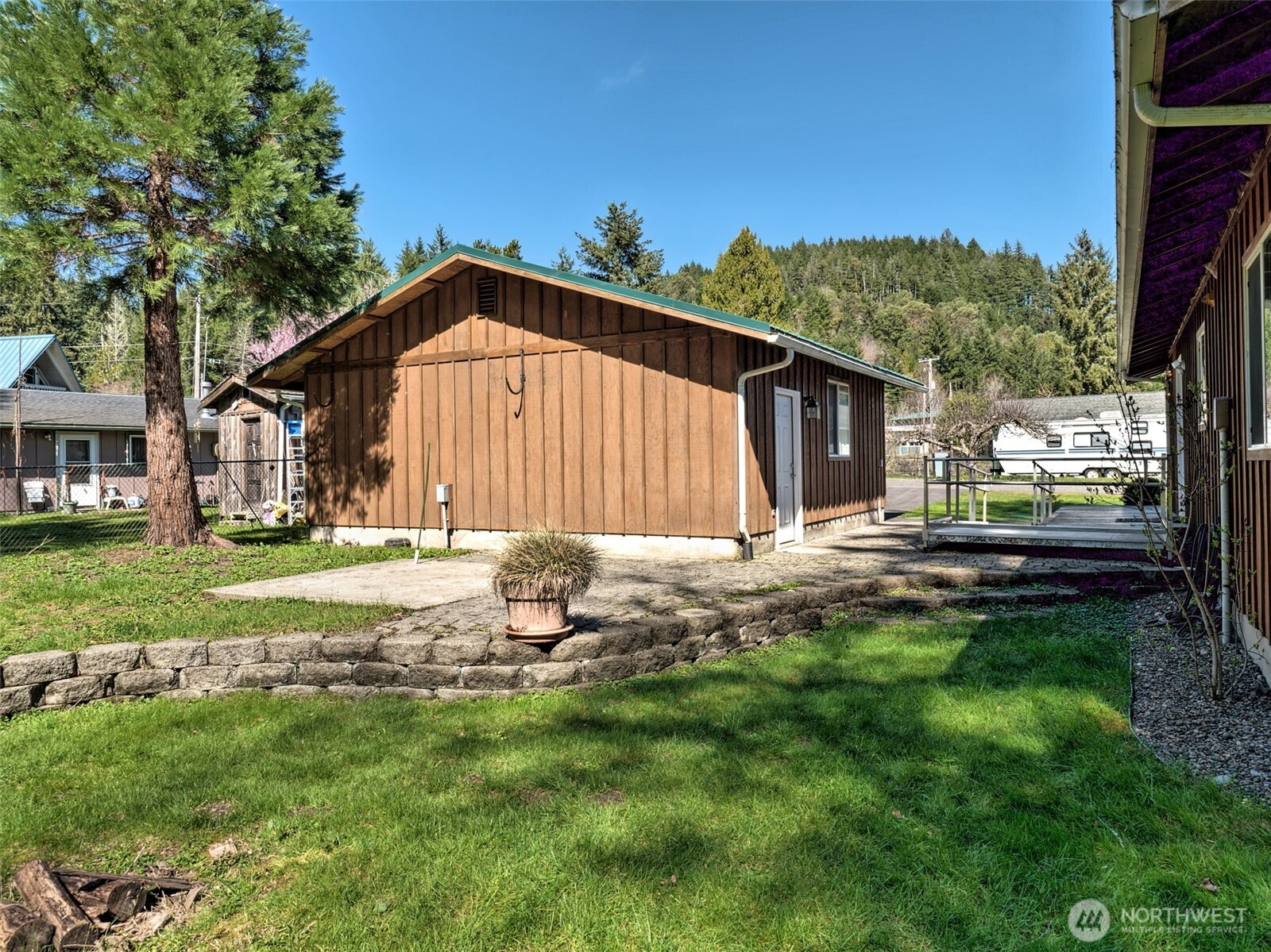30 Brook Place Tahuya, WA 98588 - Photo 9 of 40 a backyard of a house with table and chairs