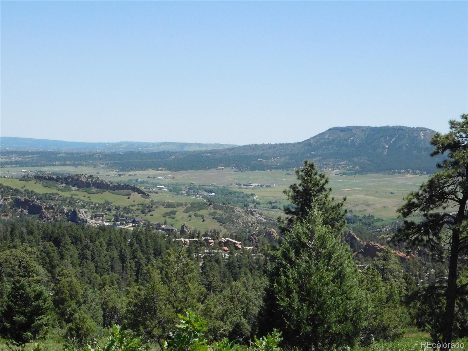 5900 Pawnee Road Larkspur, CO 80118 - Photo 17 of 45 an aerial view of mountain with trees