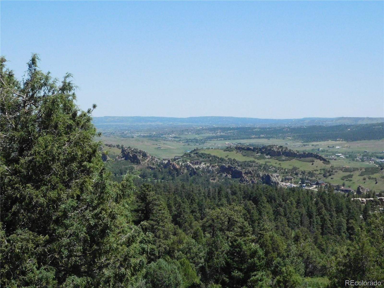 5900 Pawnee Road Larkspur, CO 80118 - Photo 22 of 45 an aerial view of forest