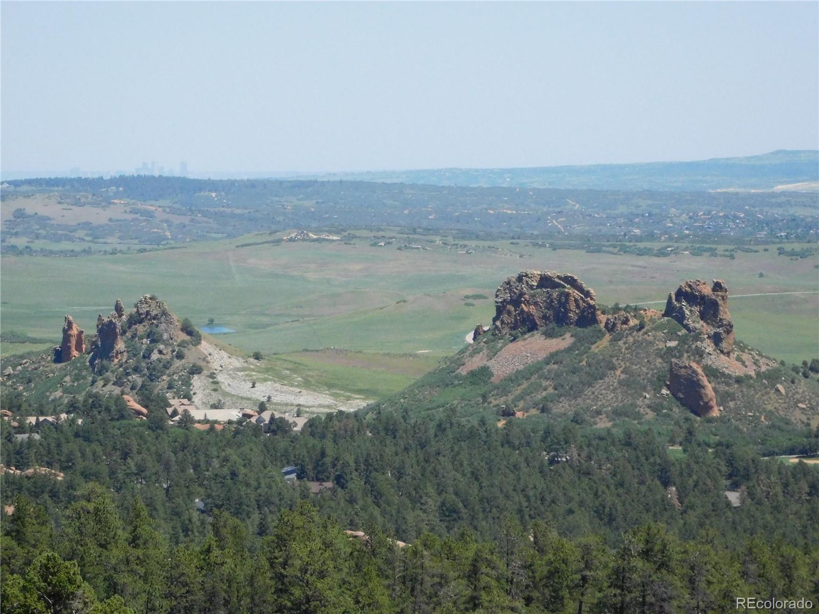 5900 Pawnee Road Larkspur, CO 80118 - Photo 32 of 45 a view of a lake from a yard