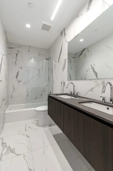 160 Franklin Street, Unit 5 Manhattan, NY 10013 - Photo 10 of 12 a spacious bathroom with a bathtub sink and mirror