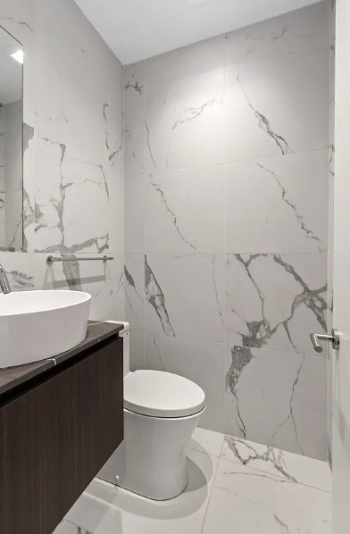 160 Franklin Street, Unit 5 Manhattan, NY 10013 - Photo 11 of 12 a bathroom with a sink toilet and shower