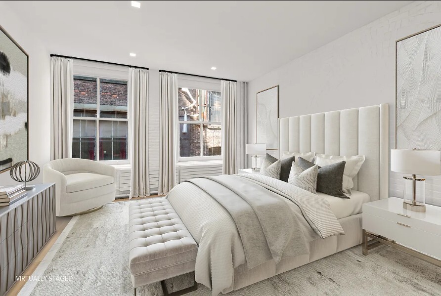 160 Franklin Street, Unit 5 Manhattan, NY 10013 - Photo 3 of 12 a bedroom with a bed and a large window