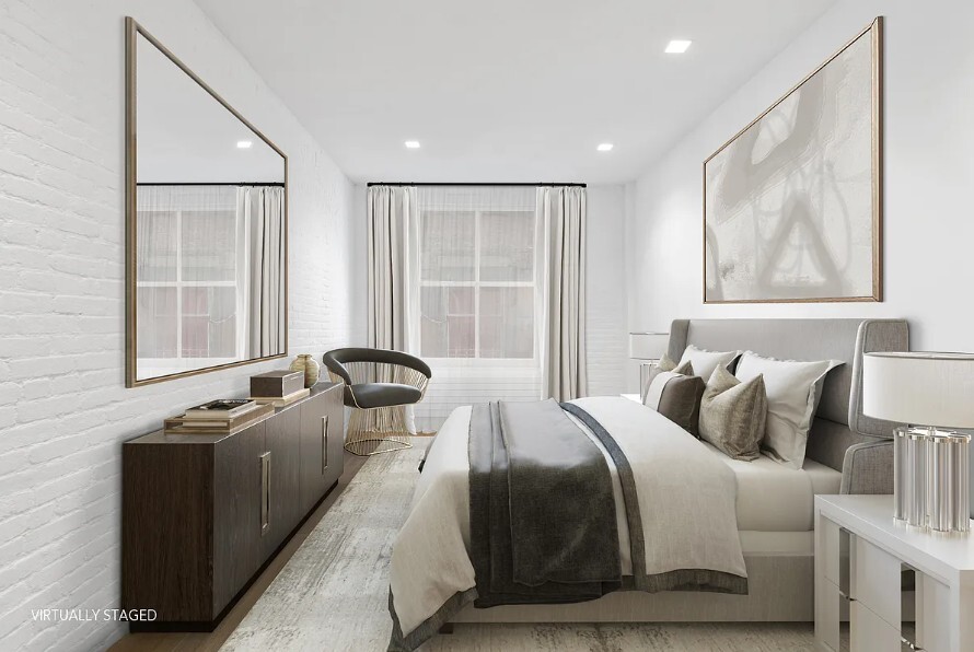 160 Franklin Street, Unit 5 Manhattan, NY 10013 - Photo 5 of 12 a bedroom with a bed and wooden floor