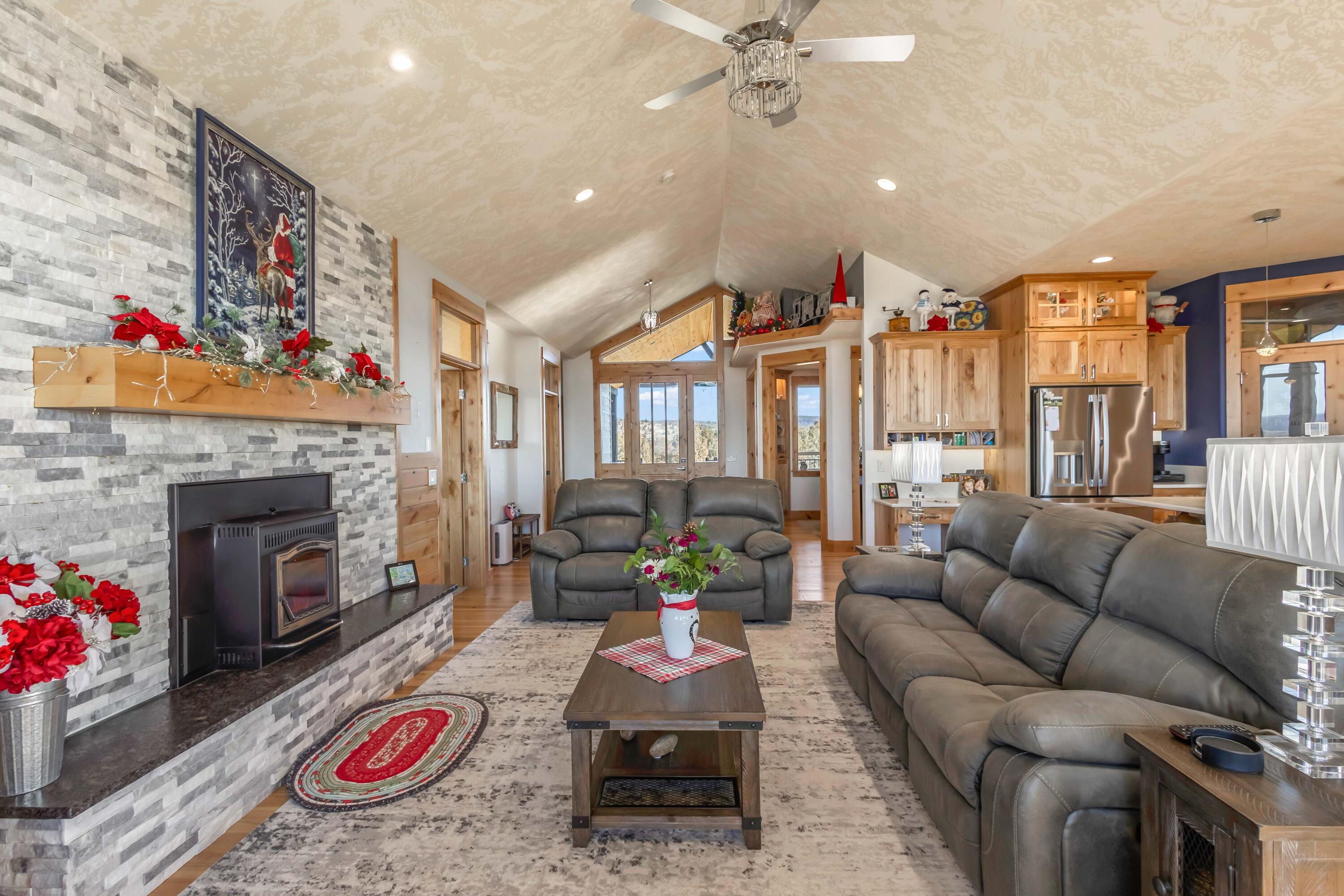 5582 North Mckay Road Prineville, OR 97754 - Photo 10 of 54 a living room with furniture and a fireplace