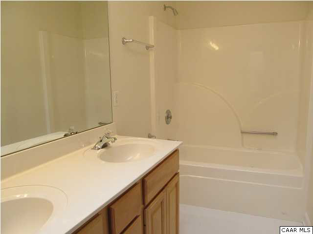 4 Slice Road Palmyra, VA 22963 - Photo 16 of 25 Master bath has raised, double vanities, shower/whirlpool tub. Separate water closet not shown. Skylight in bath too. Ceramic tile floor.