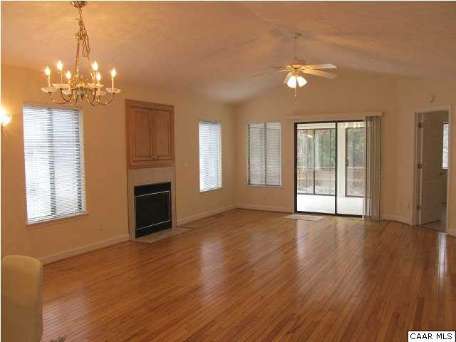 Great room with hardwood floors & fireplace.