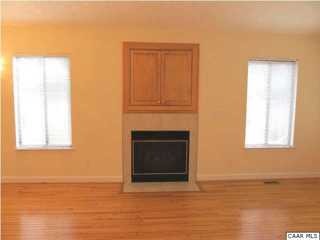 Gas log fireplace with built in entertainment center.