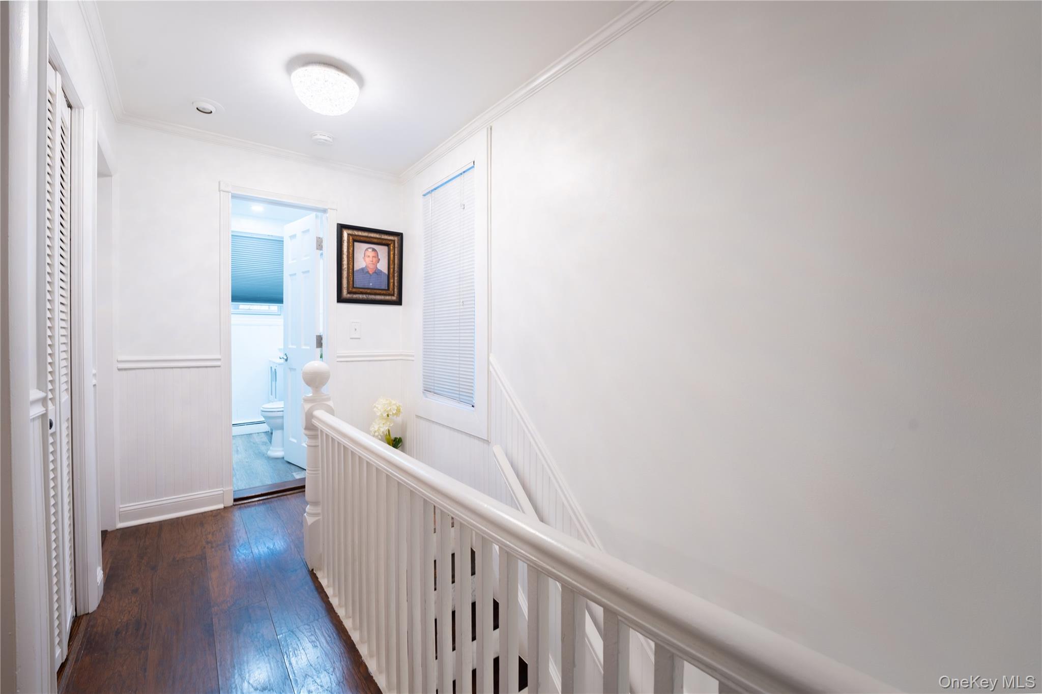 1925 Radcliff Avenue Bronx, NY 10462 - Photo 11 of 27 a hallway with front door and wooden floor