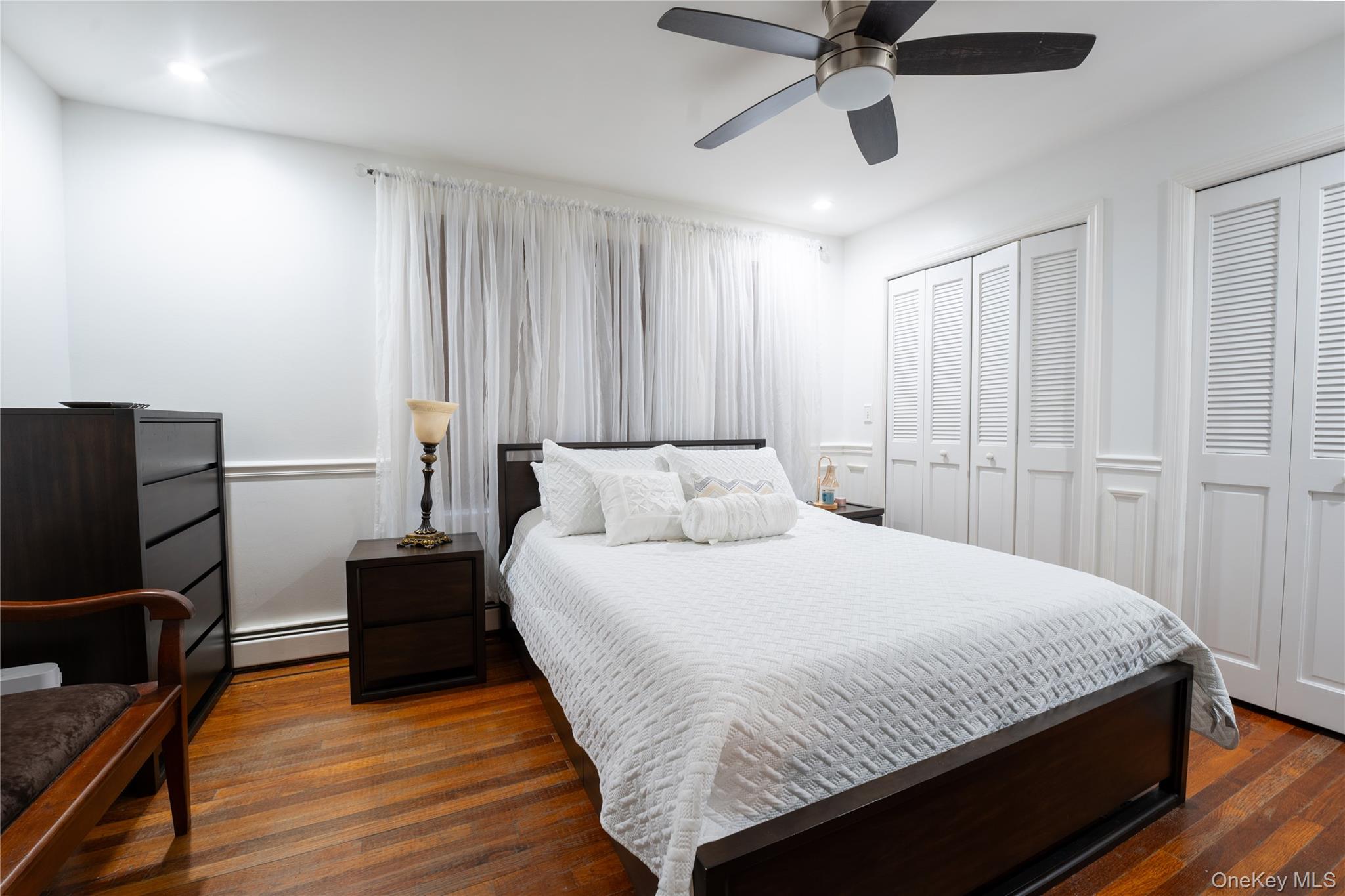 1925 Radcliff Avenue Bronx, NY 10462 - Photo 12 of 27 a bedroom with a bed and window