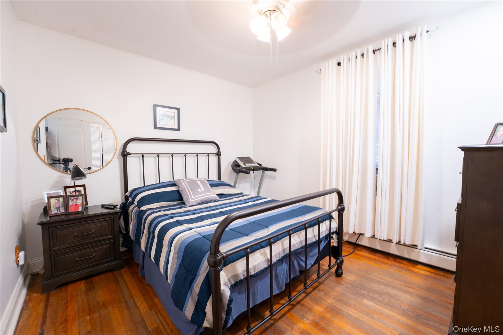 1925 Radcliff Avenue Bronx, NY 10462 - Photo 13 of 27 a bedroom with bed and a window