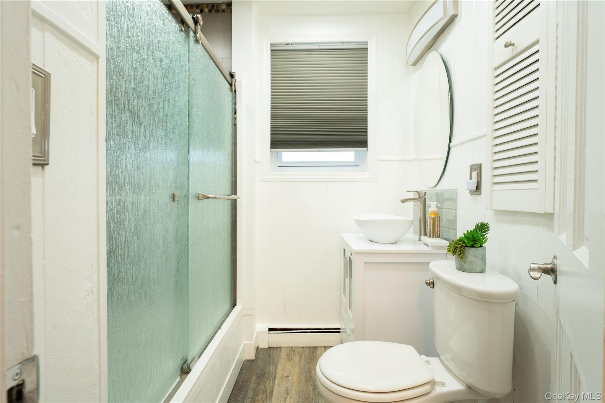1925 Radcliff Avenue Bronx, NY 10462 - Photo 15 of 27 a white toilet sitting next to a bathroom sink