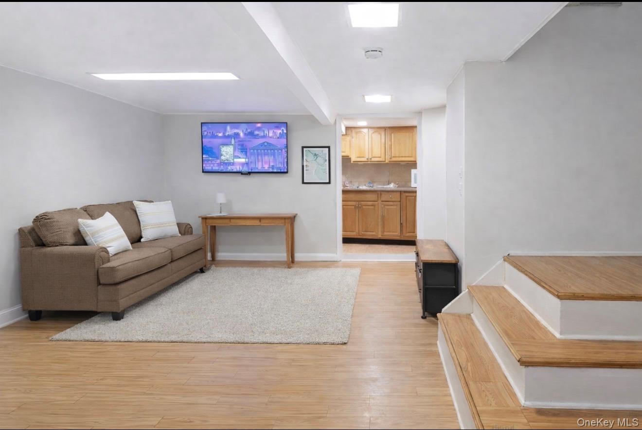 1925 Radcliff Avenue Bronx, NY 10462 - Photo 17 of 27 a living room with furniture and a couch