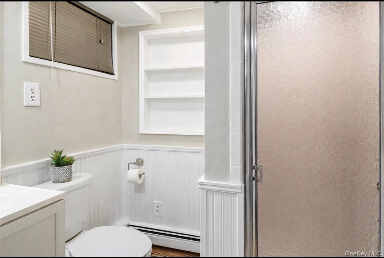 1925 Radcliff Avenue Bronx, NY 10462 - Photo 18 of 27 a white toilet sitting next to a bathroom sink
