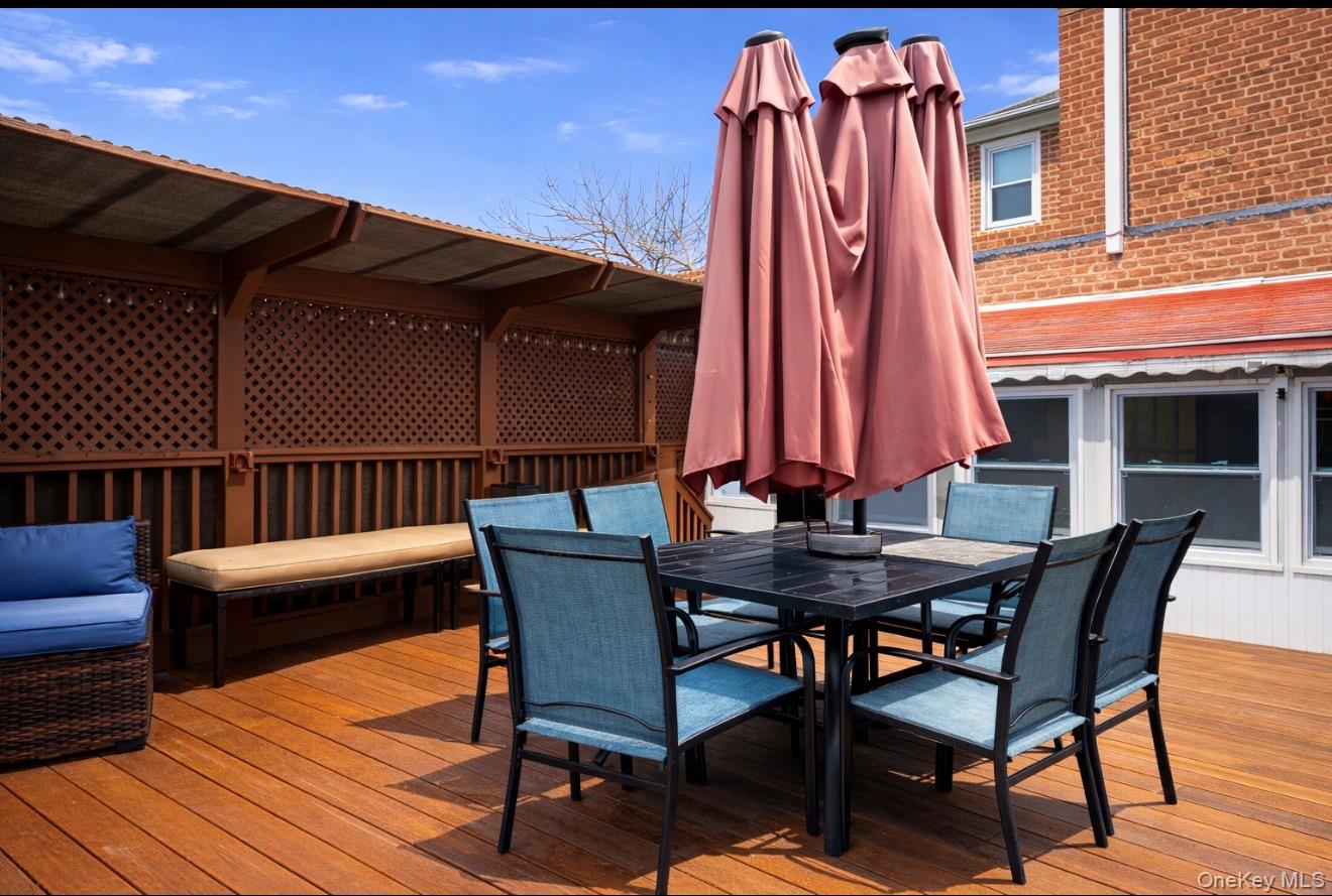 1925 Radcliff Avenue Bronx, NY 10462 - Photo 20 of 27 a view of a chairs and table on the deck