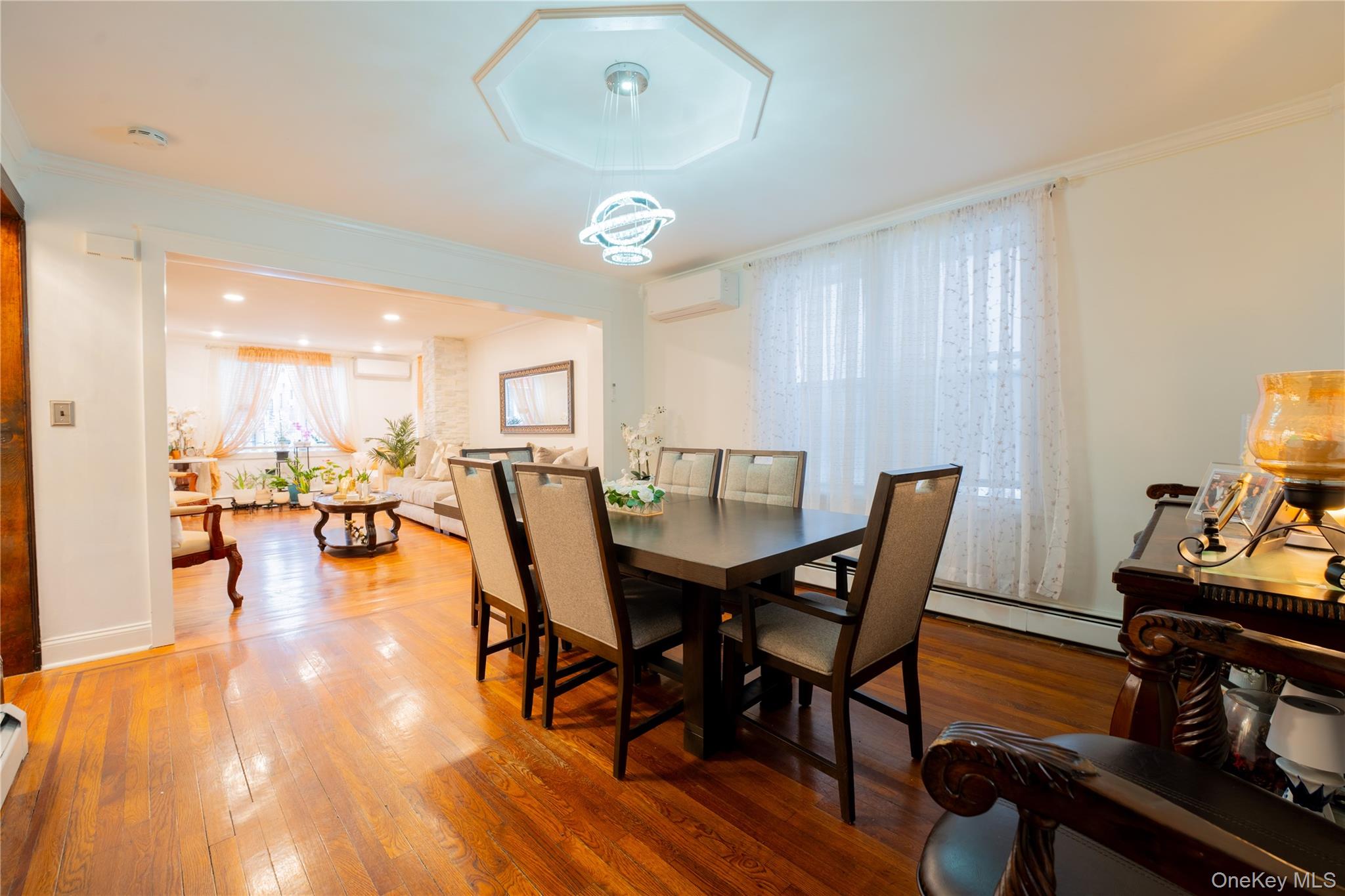 1925 Radcliff Avenue Bronx, NY 10462 - Photo 4 of 27 a view of a dining room with furniture and wooden floor