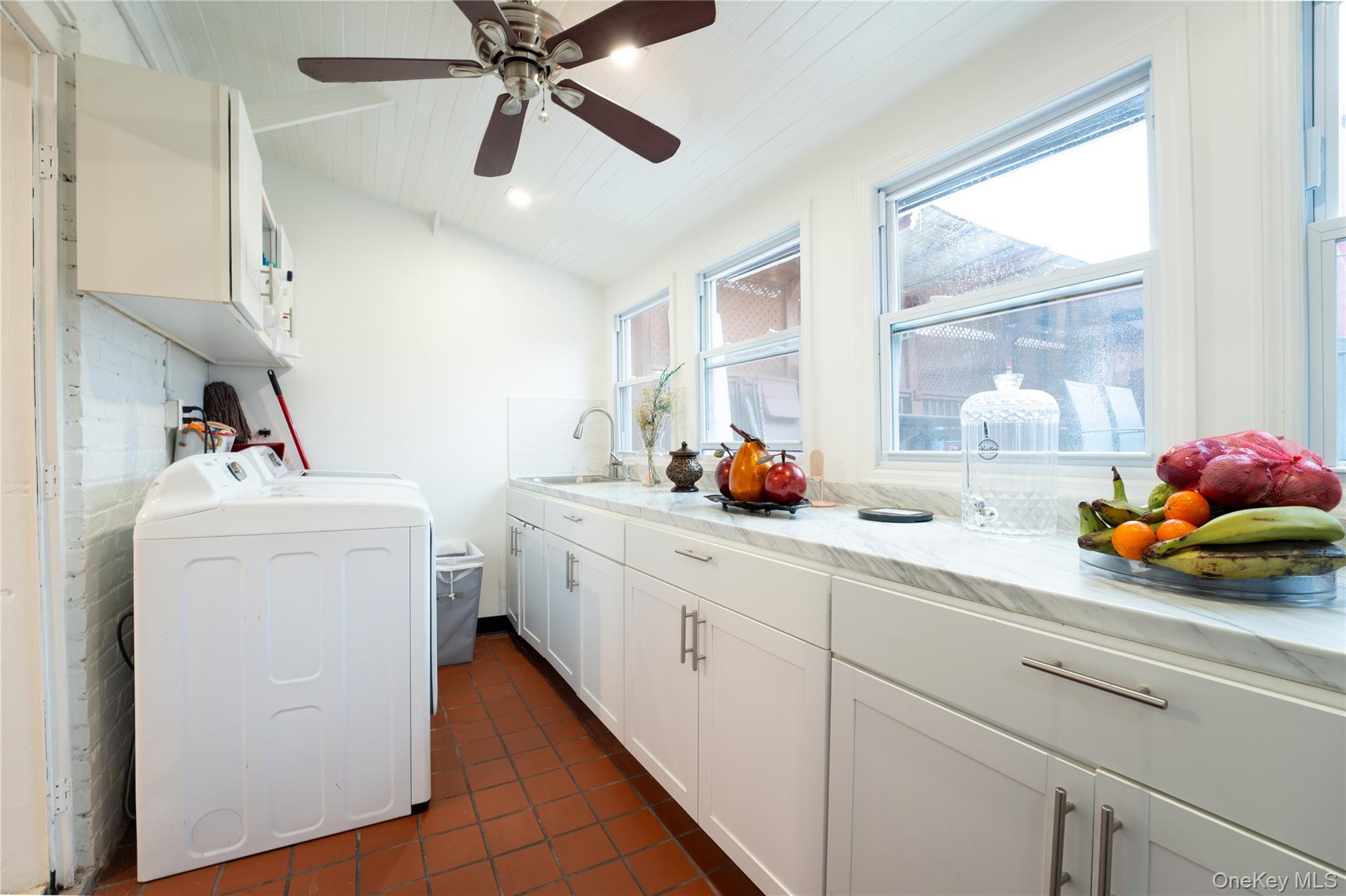 1925 Radcliff Avenue Bronx, NY 10462 - Photo 8 of 27 a utility room with sink dryer and washer