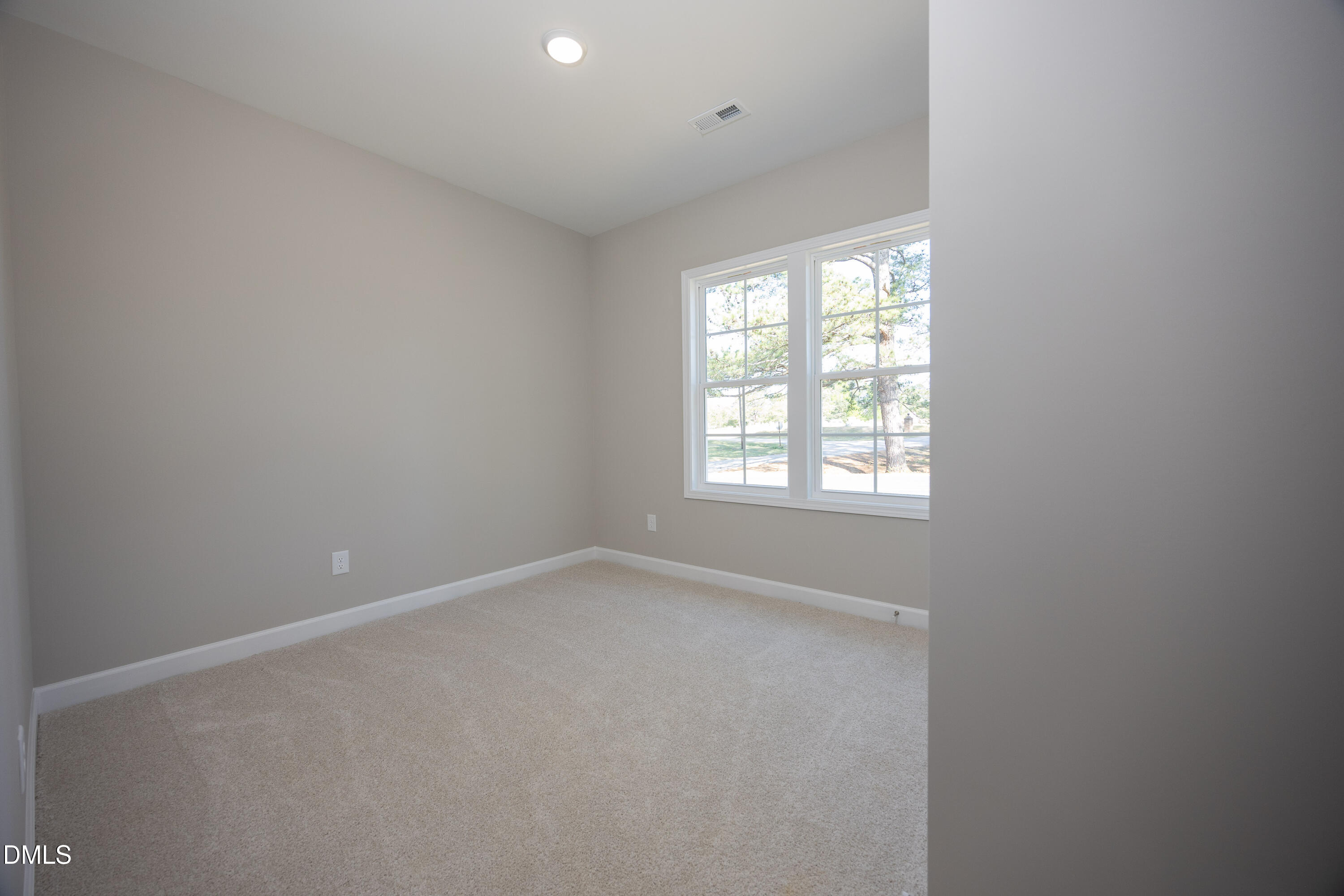179 West Hamer Street Coats, NC 27521 - Photo 18 of 26 an empty room with a window