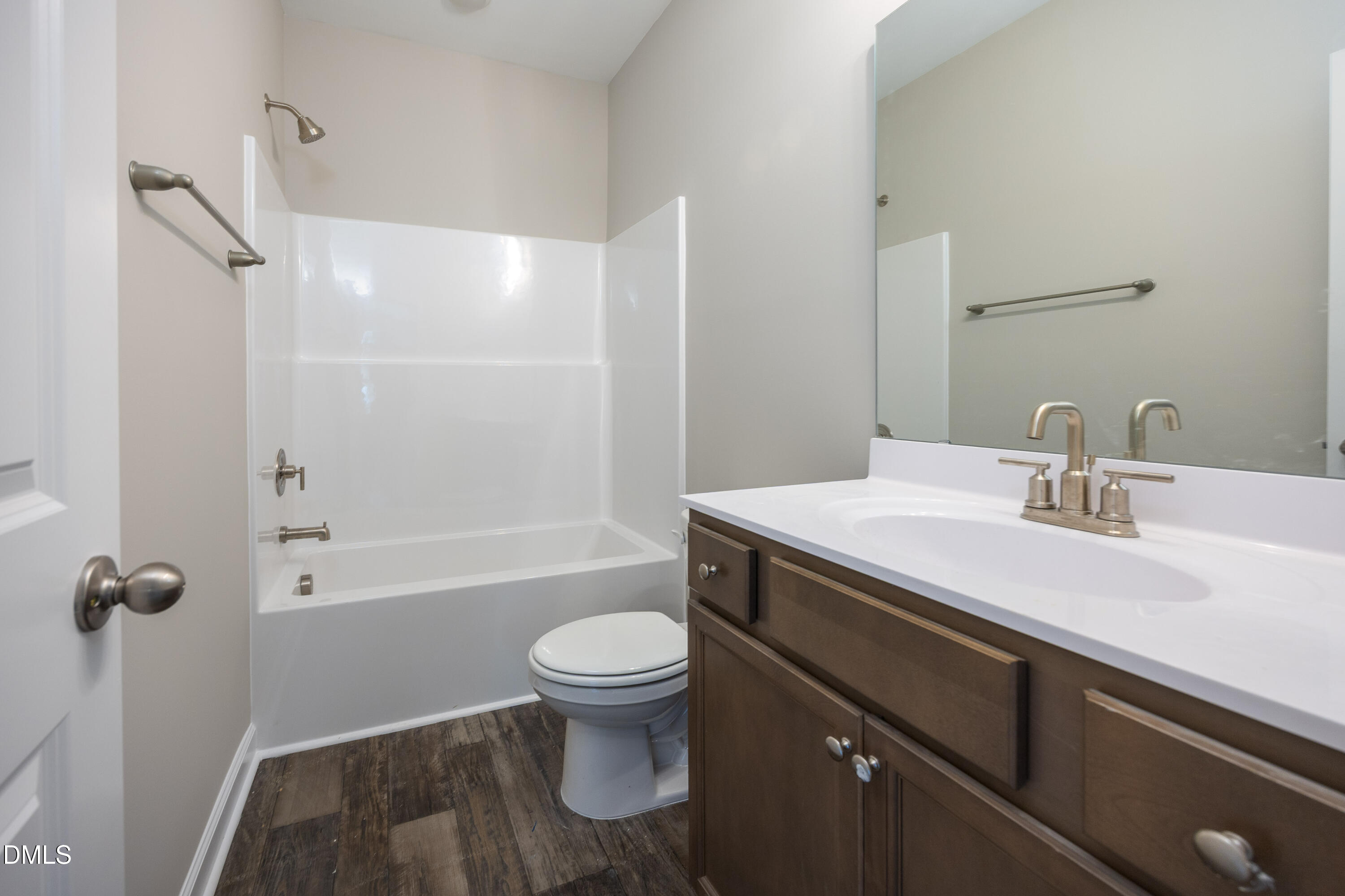 179 West Hamer Street Coats, NC 27521 - Photo 20 of 26 a bathroom with a sink a toilet and shower