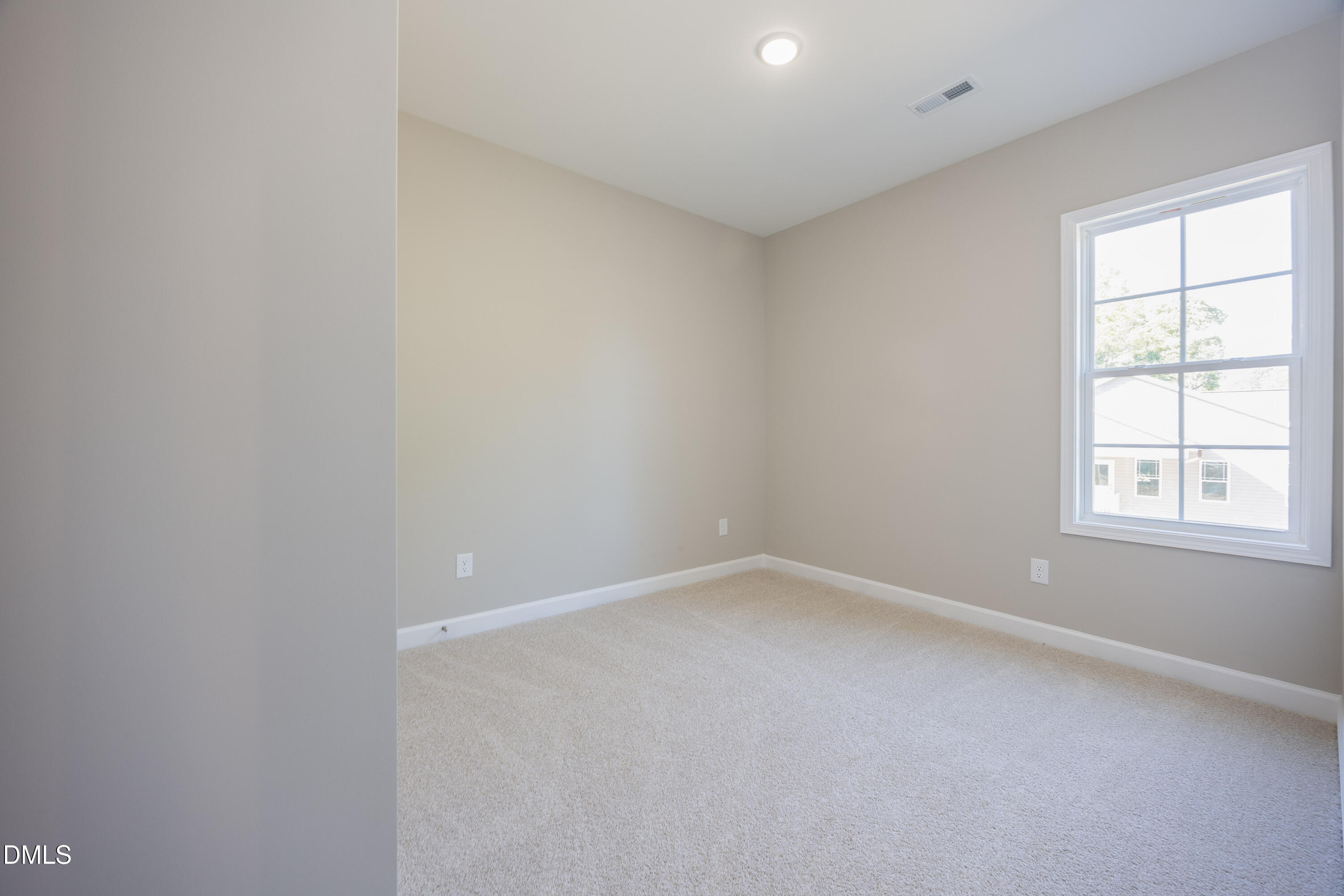 179 West Hamer Street Coats, NC 27521 - Photo 21 of 26 an empty room with a window